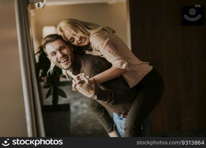 Handsome young couple having fun in the room