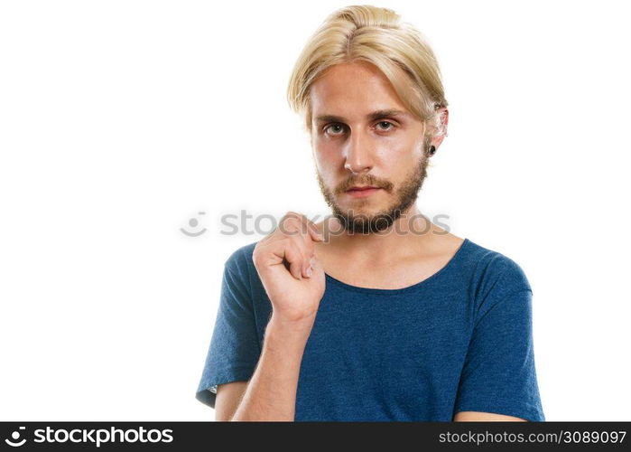 Handsome young fashion model with colored hair highlighted stylish haircut, pierced ear plug, isolated on white. Portrait young man with stylish haircut