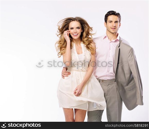 Handsome young guy with fabulous and cheerful girlfriend