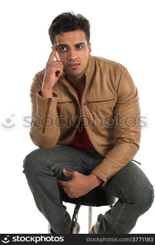 Handsome young Indian man with a pensive expression