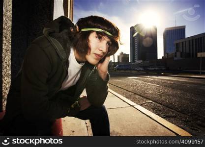 Handsome young man at sundown in an urban setting