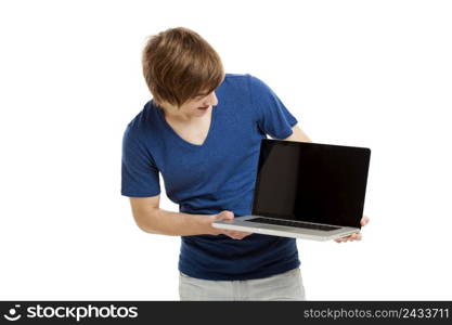 Handsome young man holding a laptop isolated over a white background