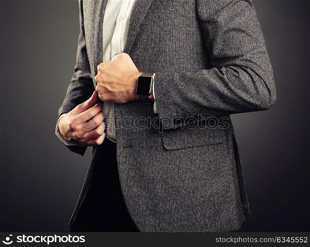 Handsome Young Man in Business Suit. Casual Style and Electronic Gadgets. Smart Watch, Business style