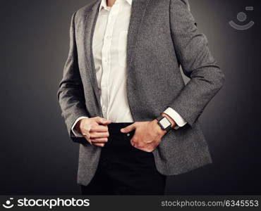 Handsome Young Man in Business Suit. Casual Style and Electronic Gadgets. Smart Watch, Business style