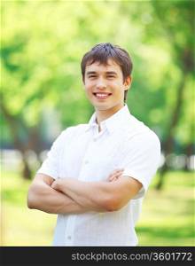 Handsome young man in the park. Outdoor portrait
