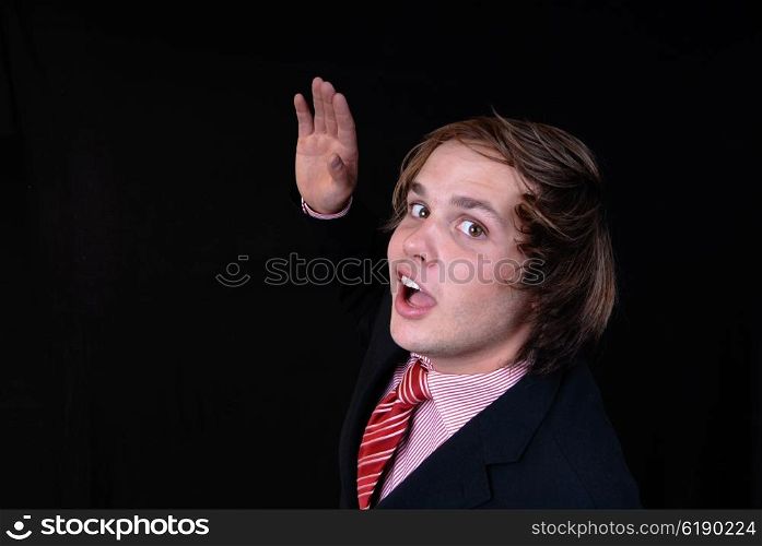 handsome young man isolated on a black background