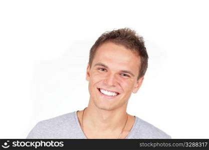 Handsome young man laughing. Isolated on white background. Studio shot.