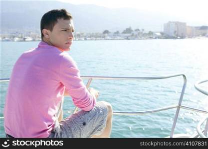 Handsome young man on boat, blue summer vacation outdoor