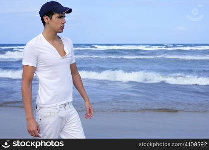 Handsome young man on the blue ocean beach summer sea