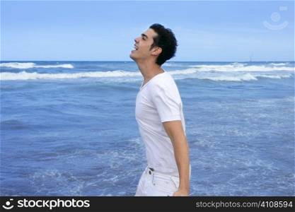 Handsome young man on the blue ocean beach summer sea