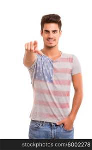 Handsome young man pointing at you, isolated over white background