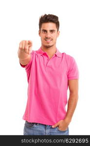 Handsome young man pointing at you, isolated over white background