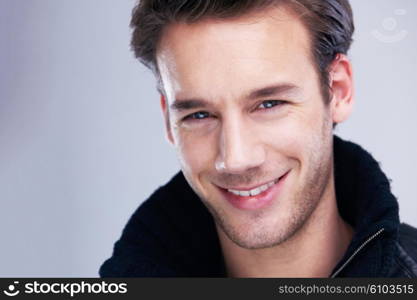 handsome young man portrait isolated on white background in studio