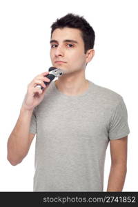 handsome young man shaving with electric shaver (isolated on white background)