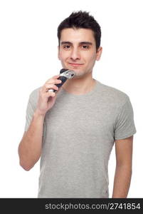 handsome young man shaving with electric shaver (isolated on white background)