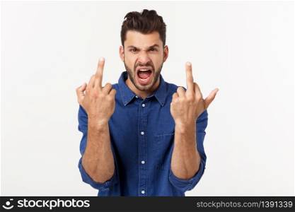 Handsome young man showing middle finger gesturing Screw you with white background. Handsome young man showing middle finger gesturing Screw you with white background.