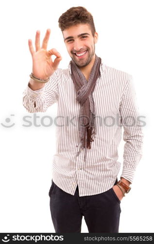 Handsome young man signaling ok, isolated over a white background