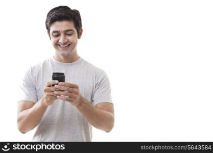 Handsome young man smiling white reading text message
