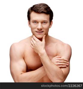 Handsome young man sniffing his armpit isolated on white. Handsome young man sniffing his armpit