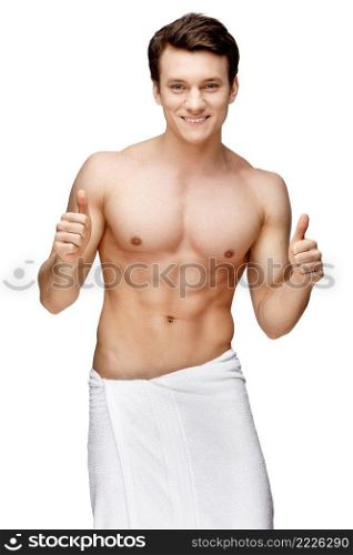 Handsome young man sniffing his armpit isolated on white. Handsome young man sniffing his armpit
