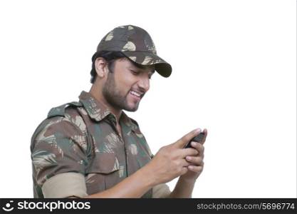 Handsome young man texting on cell phone