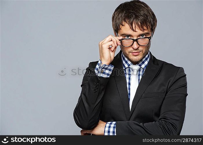 Handsome young man wearing glasses.