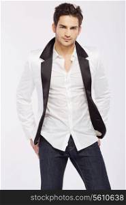 Handsome young man wearing white jacket