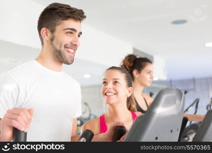 Handsome young man working out at the gym