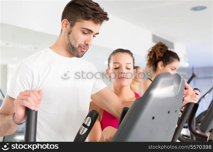 Handsome young man working out at the gym