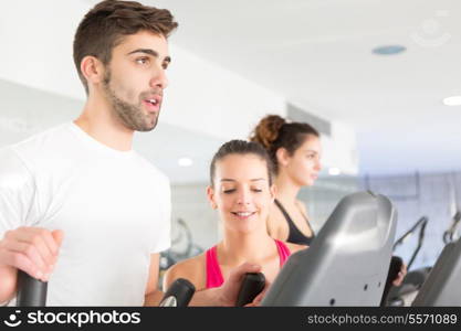 Handsome young man working out at the gym