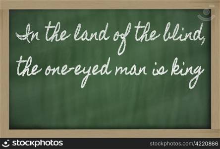 handwriting blackboard writings - In the land of the blind, the one-eyed man is king