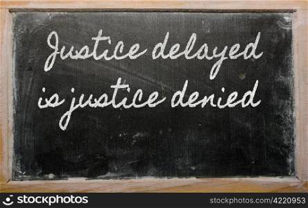 handwriting blackboard writings - Justice delayed is justice denied