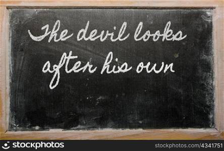 handwriting blackboard writings - The devil looks after his own