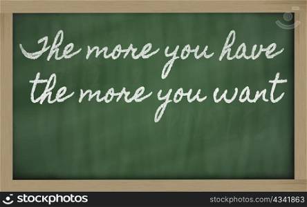 handwriting blackboard writings - The more you have, the more you want