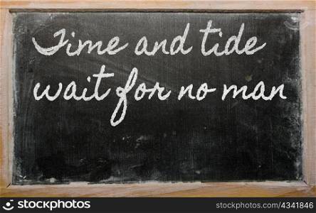 handwriting blackboard writings - Time and tide wait for no man