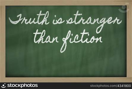 handwriting blackboard writings - Truth is stranger than fiction