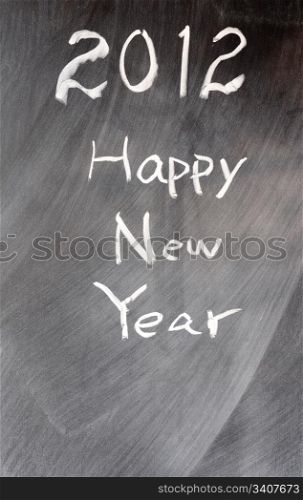 Handwriting of Happy New Year 2012 on a blackboard