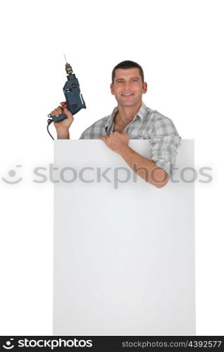 Handyman behind white board