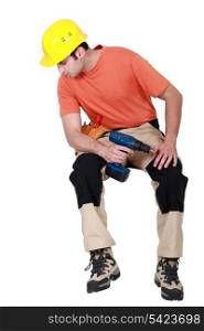 Handyman casually sat with drill