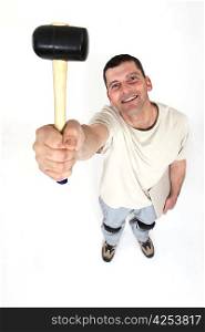 Handyman holding a mallet in the air