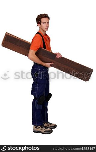 Handyman holding planks isolated on white background