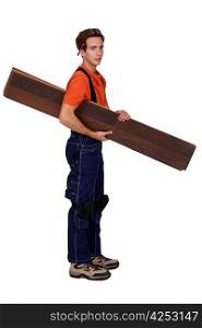 Handyman holding planks isolated on white background