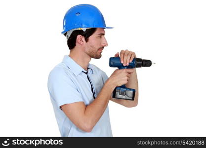 handyman in profile using drill