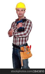 Handyman posing with cordless drill