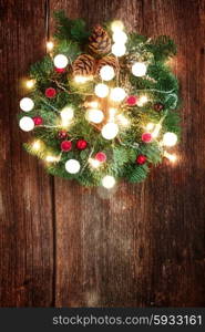 hanging christmas green wreath with glowing lights, retro toned