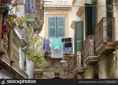 Hanging clothes in Old alley in the old town of Gallipoli (Le)) in the southern of Italy