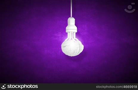Hanging light bulb. Illuminating hanging light bulb on dark background
