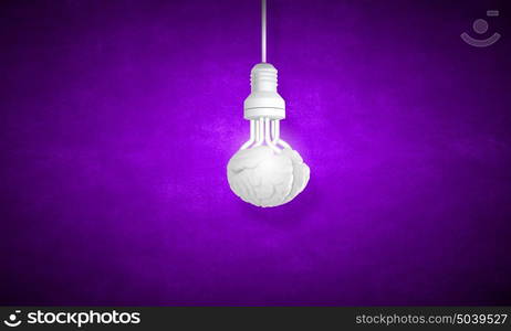 Hanging light bulb. Illuminating hanging light bulb on dark background