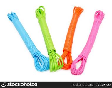 hanks of colorful plastic linen ropes, over white