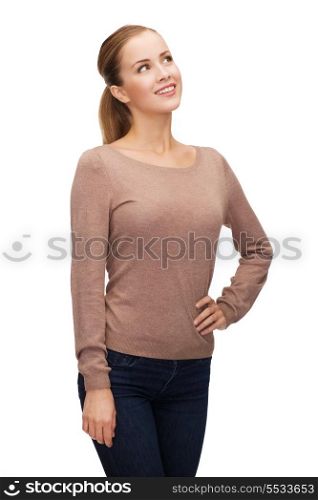 hapiness and people concept - happy smiling young woman dreaming
